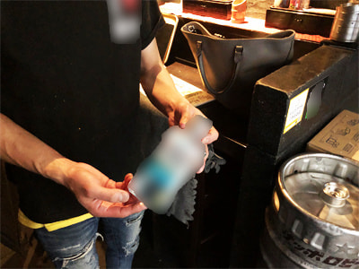 居酒屋スタッフと利用客に向けた薬用マウスウォッシュのサンプリング事例2